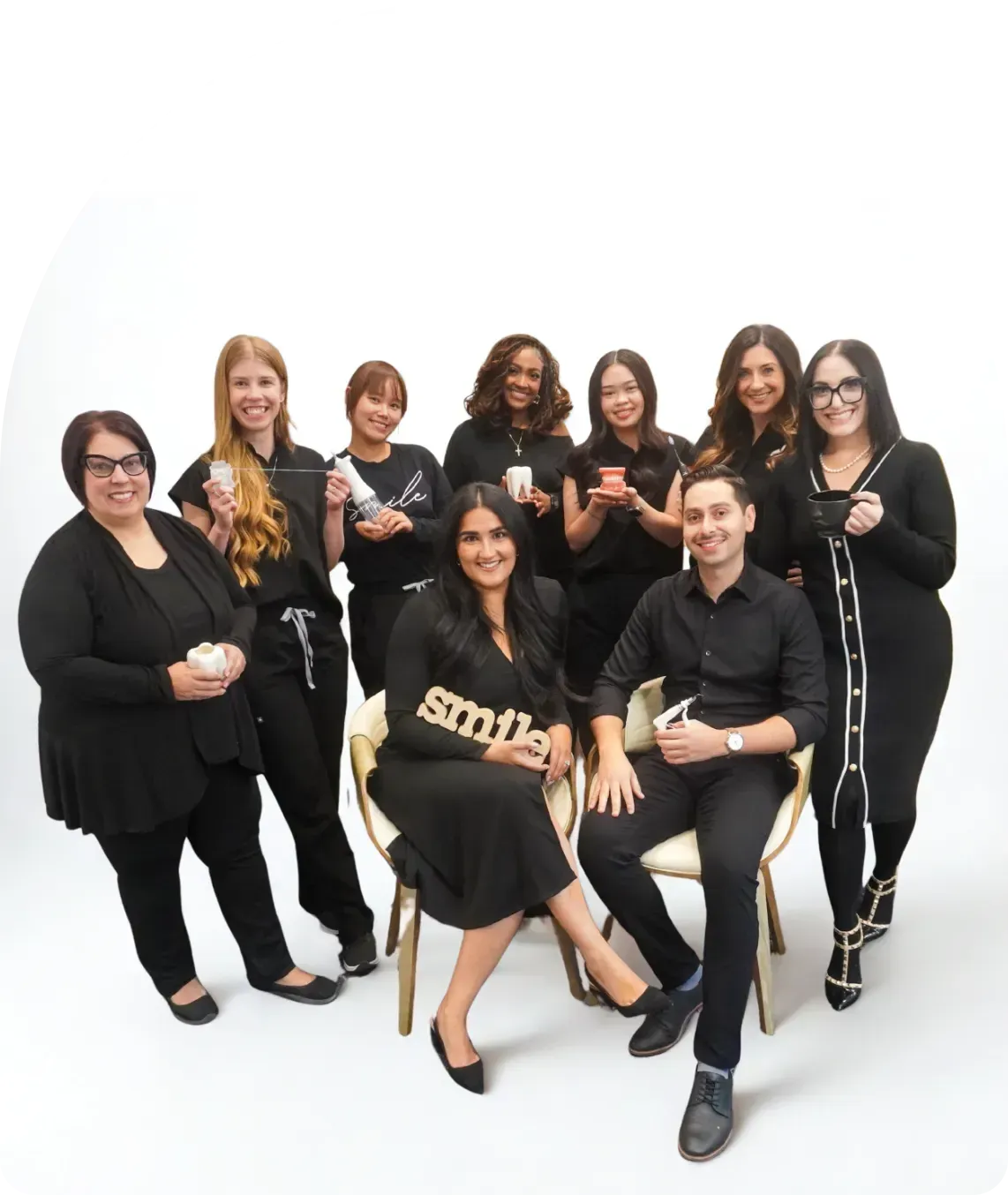The University District Dental team seated together